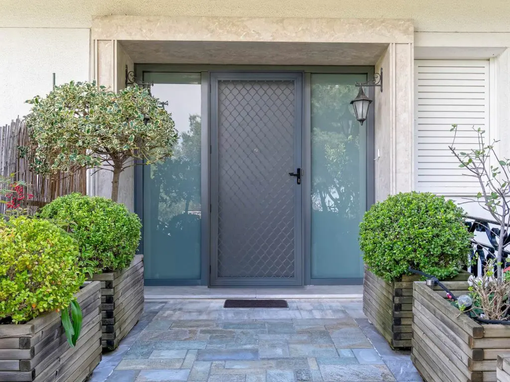 Amplimesh security screen door fitted to the front entry of an Auckland home